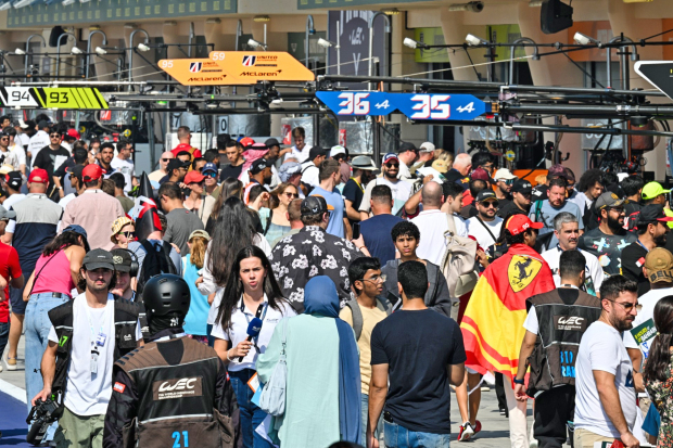 <p>Fans attending the Bapco Energies 8 Hours of Bahrain yesterday were treated to a pair of exciting fan-engagement activities held as part of the pre-race build-up at Bahrain International Circuit (BIC) in Sakhir. Scores of race-goers went for a pit walk and saw the WEC teams up close in their garages, hard at work tuning their Hypercars and LMGT3 contenders before lining up on the grid. The spectators were also able to meet their favourite WEC drivers during an autograph session, where they took pictures and had memorabilia signed. Above, a large crowd of race-goers during the pit walk at BIC.</p>